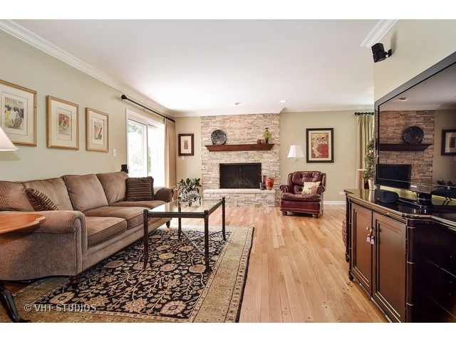 2 Old Valley Road Rolling Meadows, IL 60008 - Photo 8 of 17 a living room with furniture a fireplace and a flat screen tv