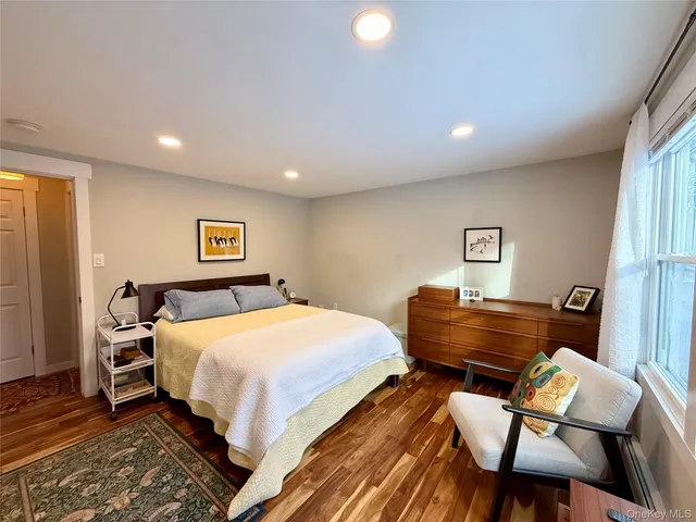 a bedroom with a bed and a chair