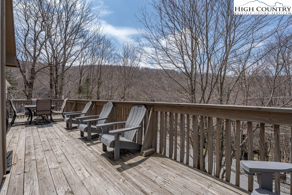 136 Tamarack Road Beech Mountain, NC 28604 - Photo 17 of 20 a roof deck with wooden floor and fence