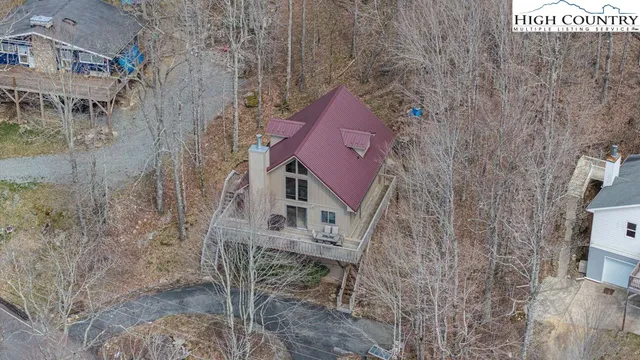 a aerial view of a house with a yard