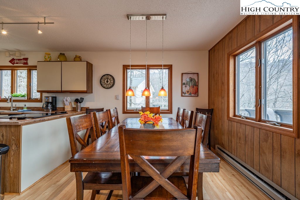 136 Tamarack Road Beech Mountain, NC 28604 - Photo 8 of 20 a view of a dining room with furniture window and outside view