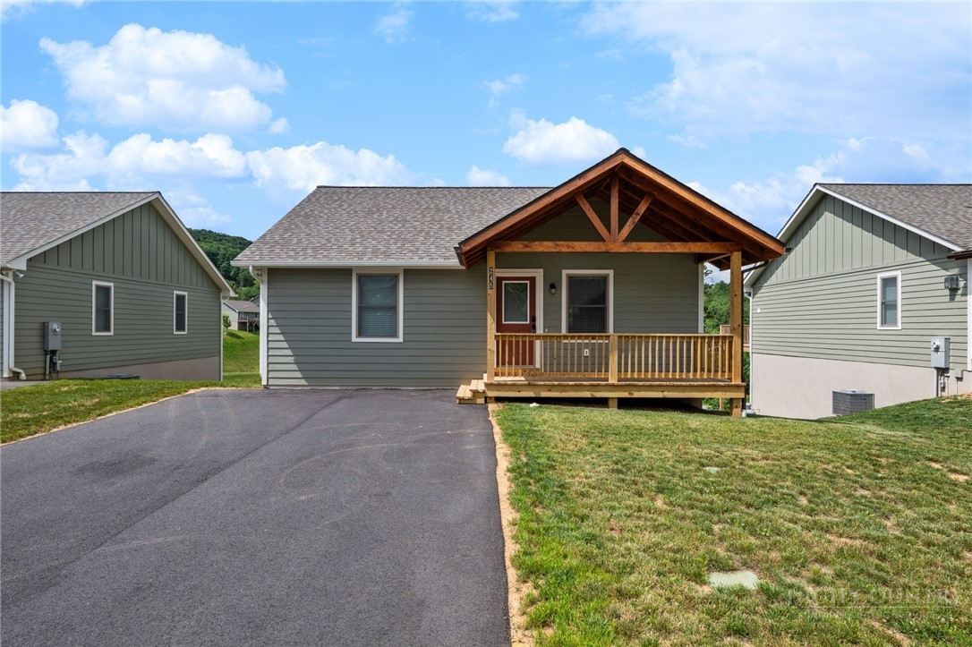 245 Ava Way, Unit 108 Boone, NC 28607 - Photo 2 of 31 a front view of a house with yard