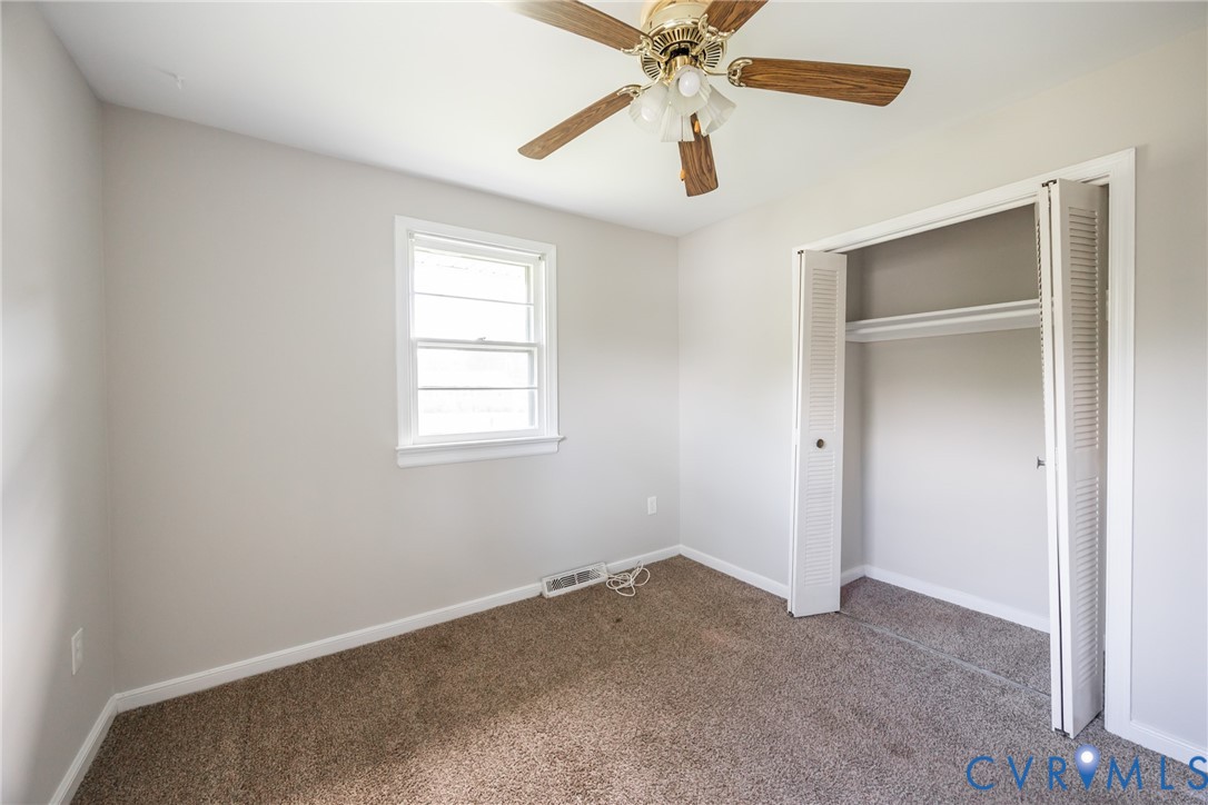 3000 Perlock Road Richmond, VA 23237 - Photo 12 of 16 Unfurnished bedroom with dark colored carpet, a cl