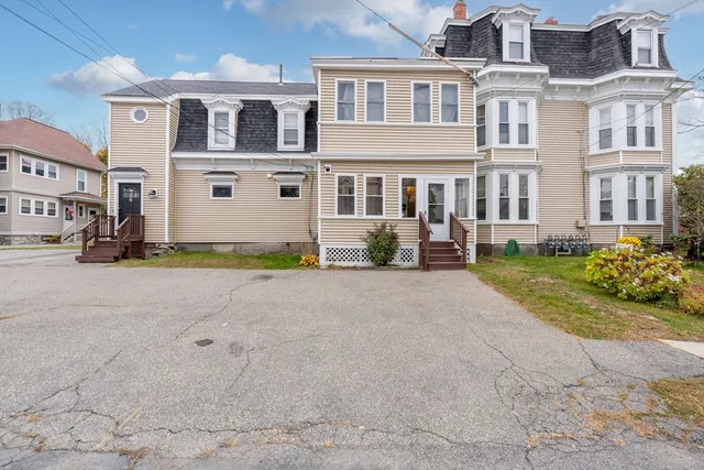 a view of a building with a yard