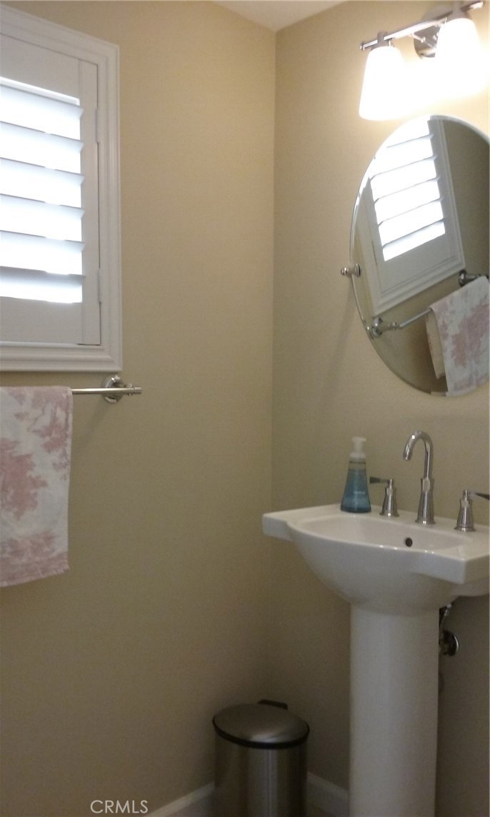 182 Working Ranch Irvine, CA 92602 - Photo 13 of 21 a bathroom with a sink a toilet and a mirror