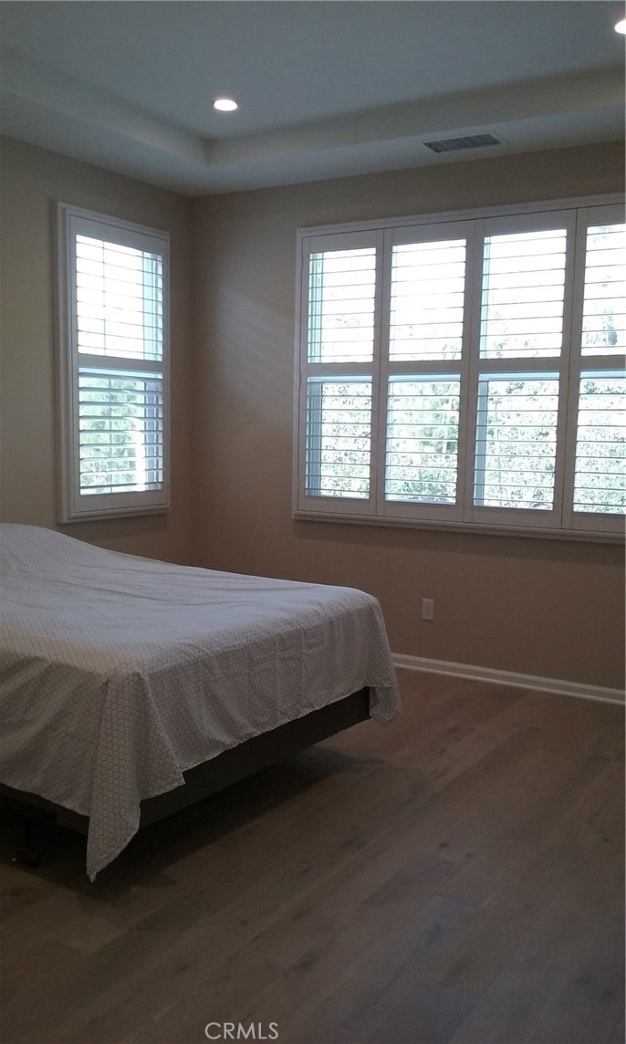 182 Working Ranch Irvine, CA 92602 - Photo 8 of 21 a bed sitting in a bedroom next to a window