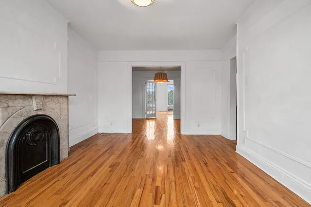 a kitchen with a stove top oven and cabinets