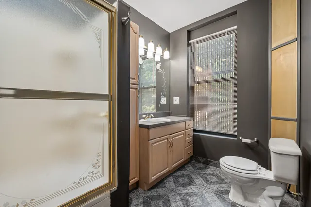 a view of a livingroom with a fireplace washer and dryer