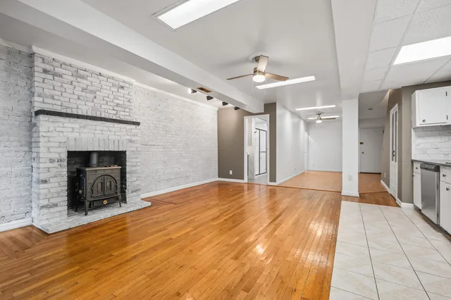a kitchen with stainless steel appliances granite countertop a stove and a refrigerator