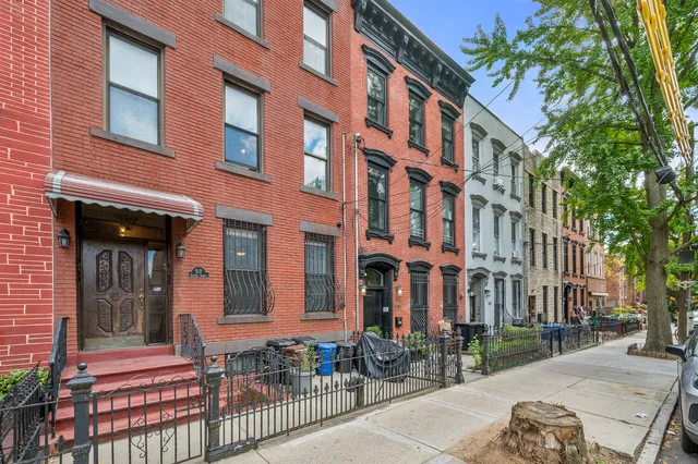 front view of a house with a small yard