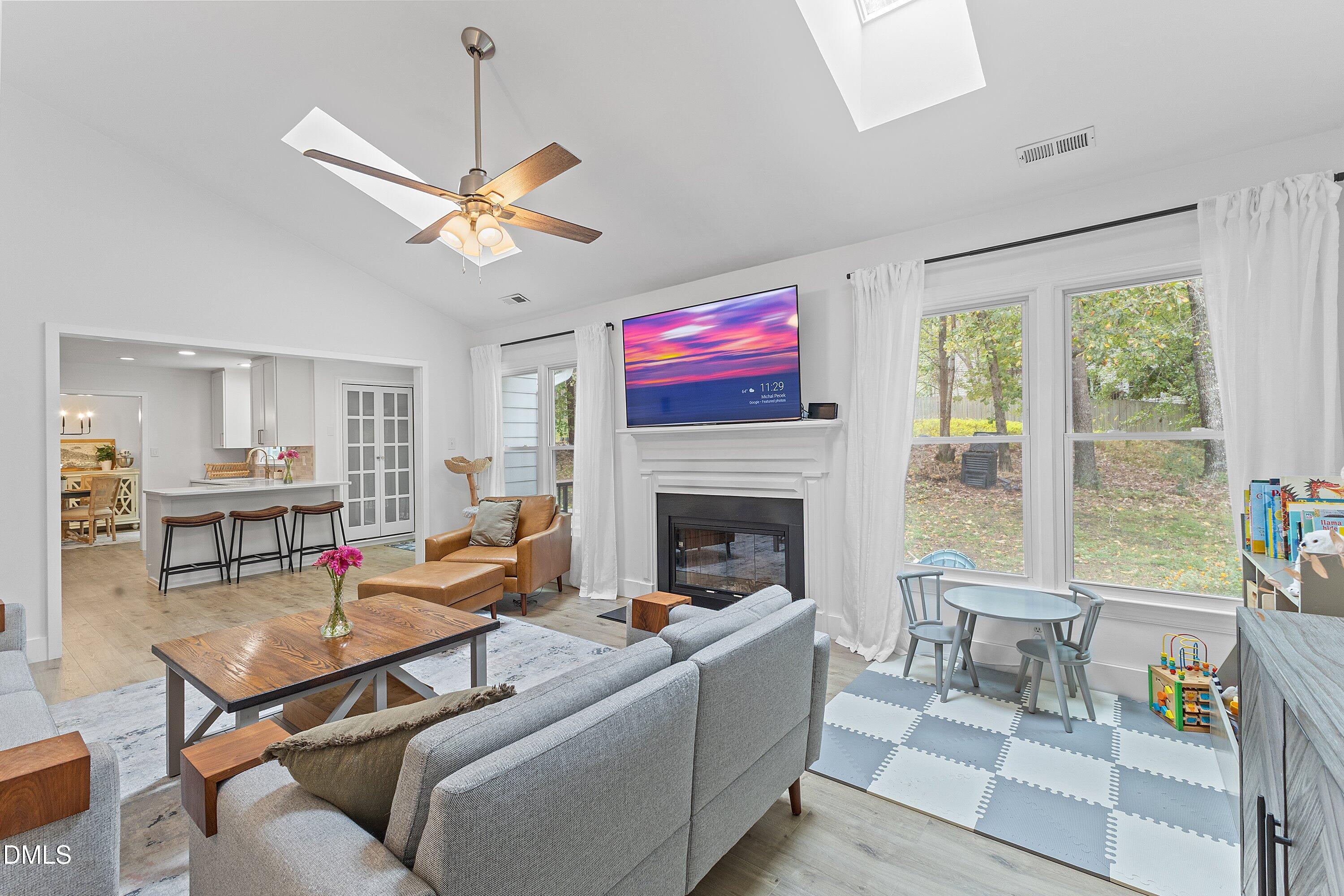 5310 Reams Run Road Durham, NC 27713 - Photo 16 of 38 a living room with furniture and a fireplace