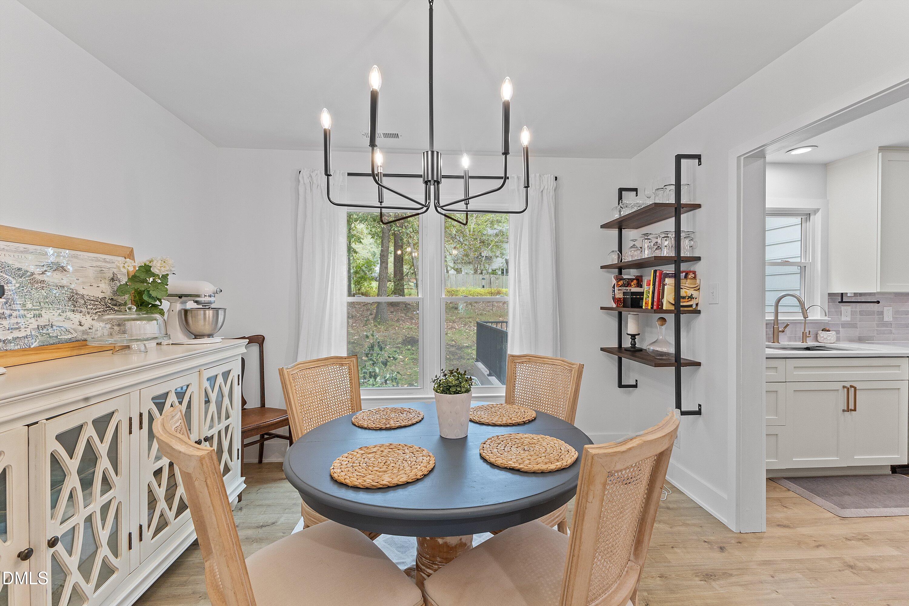 5310 Reams Run Road Durham, NC 27713 - Photo 8 of 38 a view of a dining room with furniture window and outside view