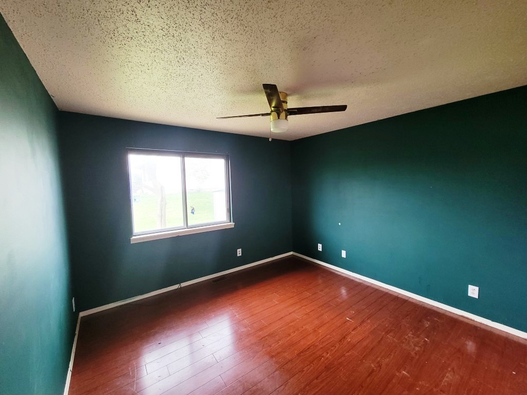 2601 Rachel Road Champaign, IL 61822 - Photo 14 of 22 an empty room with a fan and a window