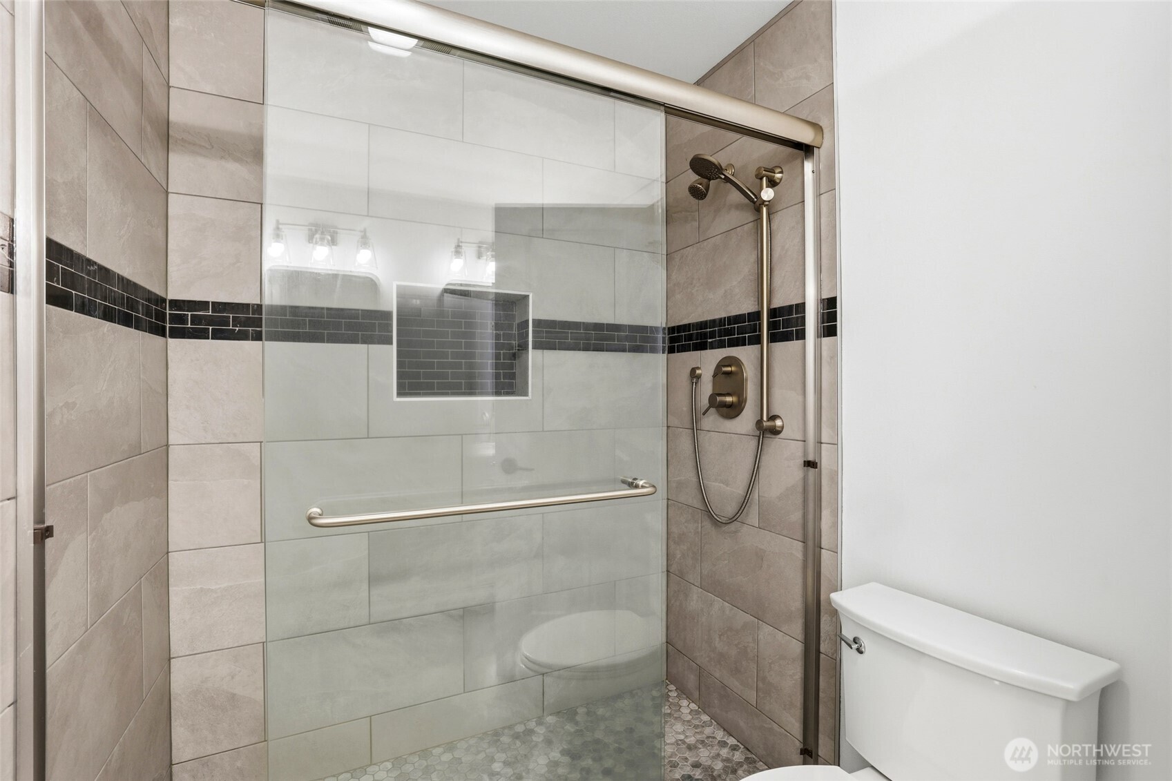 9815 178th Way Southwest Rochester, WA 98579 - Photo 24 of 36 a bathroom with a granite countertop mirror toilet and shower