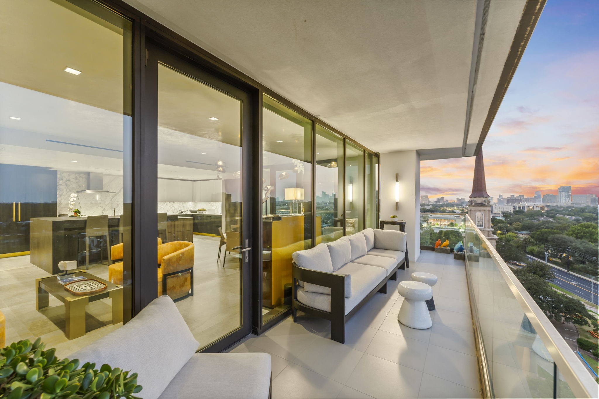 3433 Westheimer Road, Unit 1005 Houston, TX 77027 - Photo 12 of 47 Indoor–outdoor flow to a deep terrace with skyline vistas.