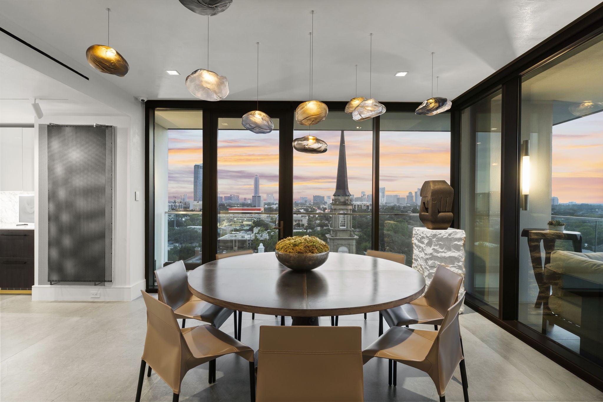 3433 Westheimer Road, Unit 1005 Houston, TX 77027 - Photo 14 of 47 a dining room with furniture and a floor to ceiling window