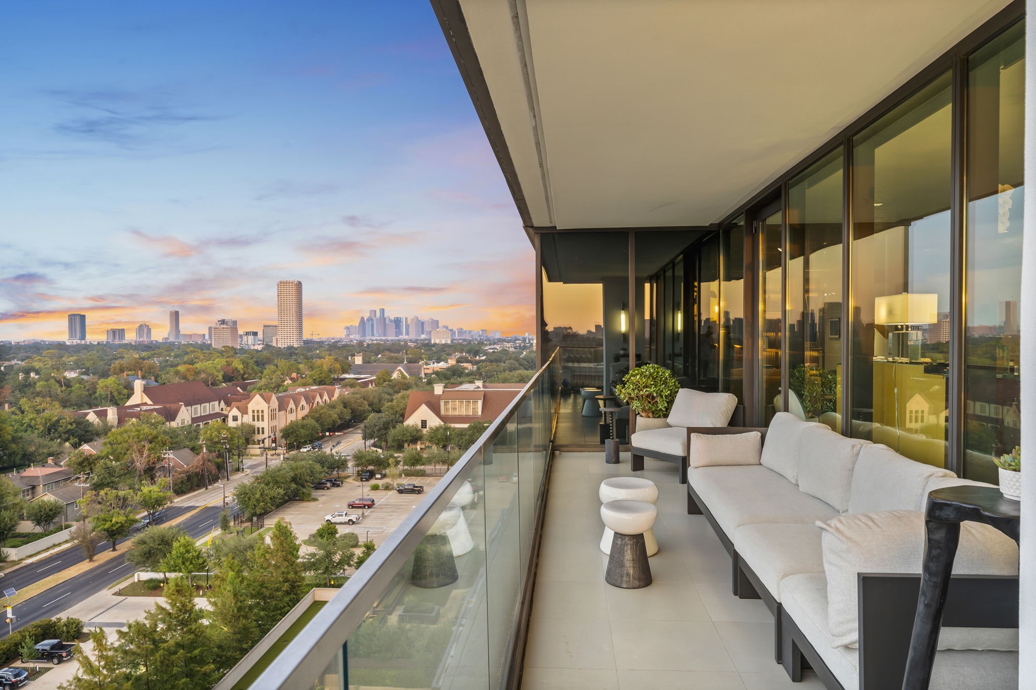 3433 Westheimer Road, Unit 1005 Houston, TX 77027 - Photo 16 of 47 a balcony with furniture and city view