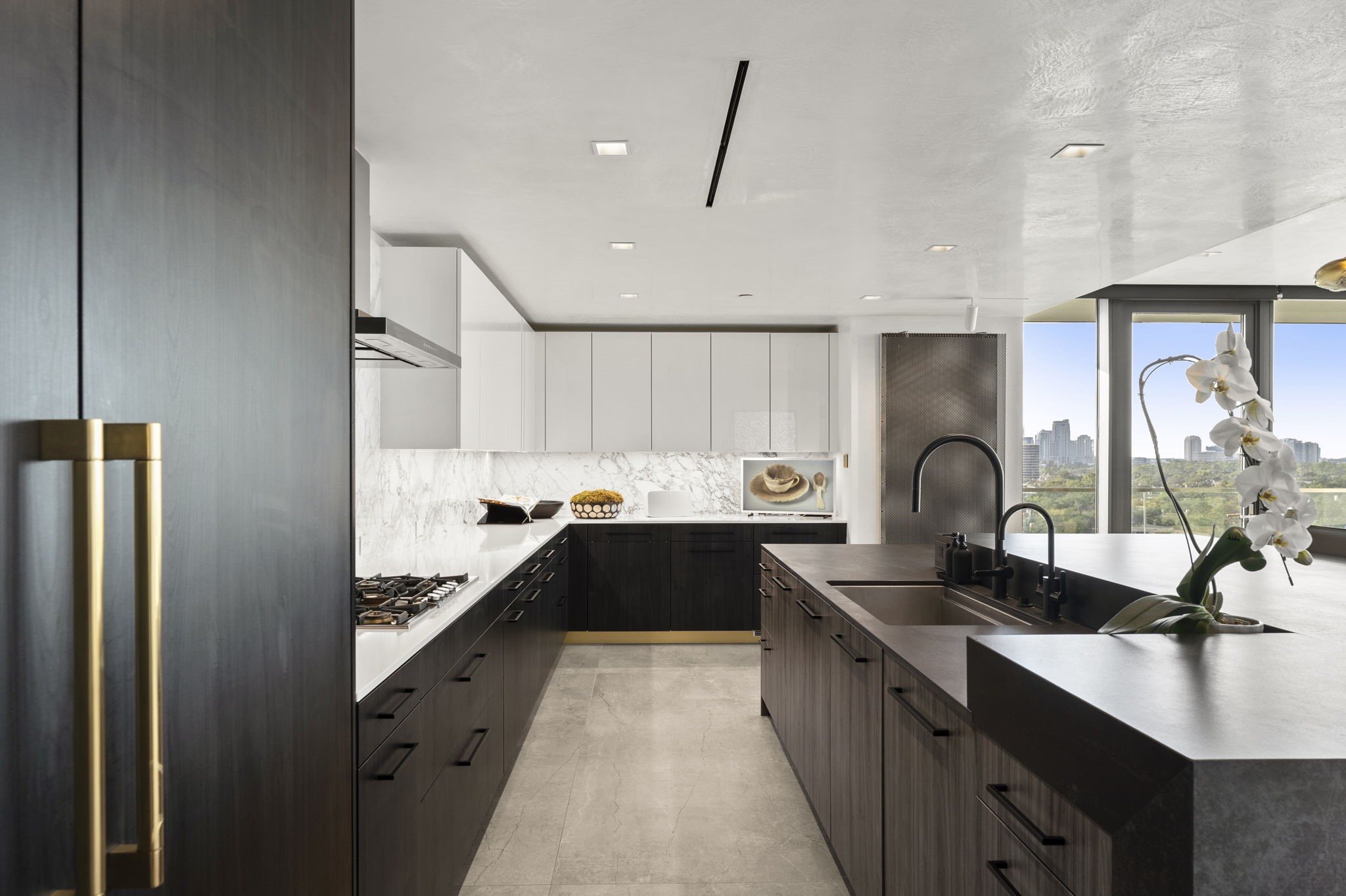 3433 Westheimer Road, Unit 1005 Houston, TX 77027 - Photo 18 of 47 Poggenpohl kitchen with Dekton surfaces, Gaggenau appliances and The Galley workstation sink with filtrated and instant hot water.