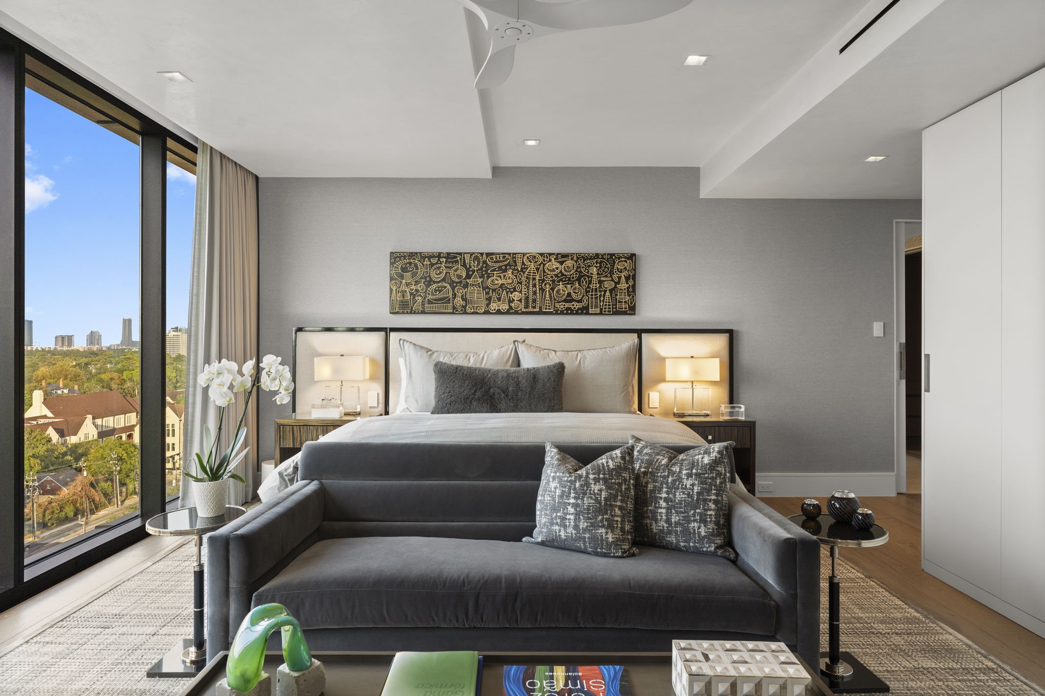 3433 Westheimer Road, Unit 1005 Houston, TX 77027 - Photo 23 of 47 Serene primary bedroom with skyline views.