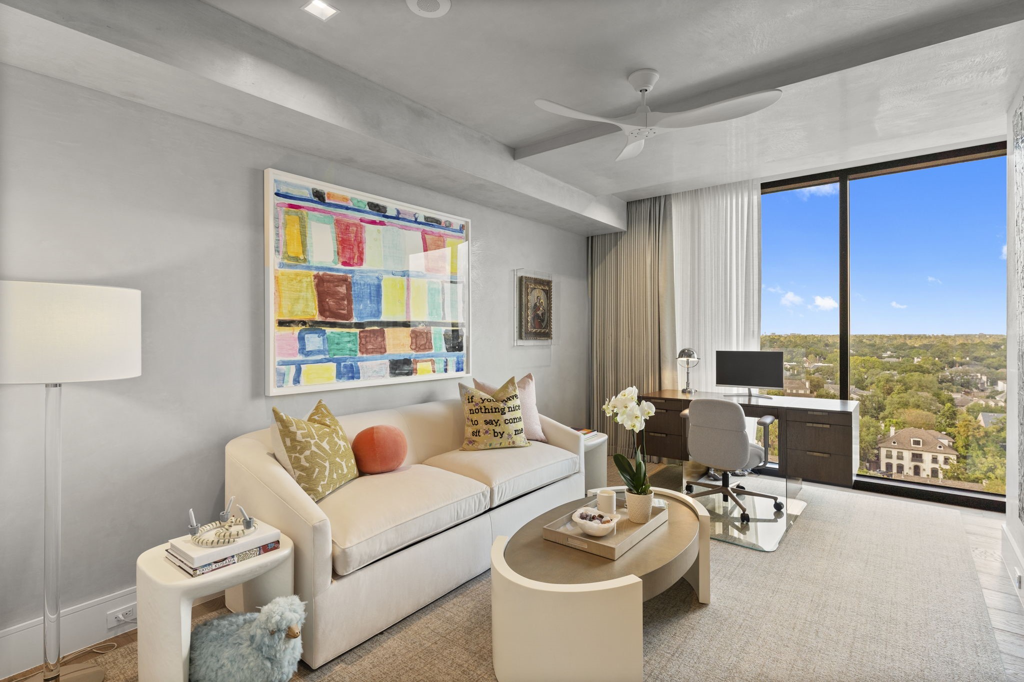 3433 Westheimer Road, Unit 1005 Houston, TX 77027 - Photo 34 of 47 a living room with furniture and floor to ceiling window