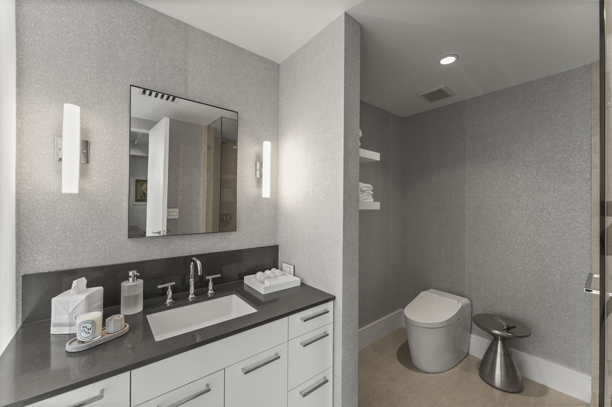 3433 Westheimer Road, Unit 1005 Houston, TX 77027 - Photo 35 of 47 a bathroom with a toilet sink and mirror