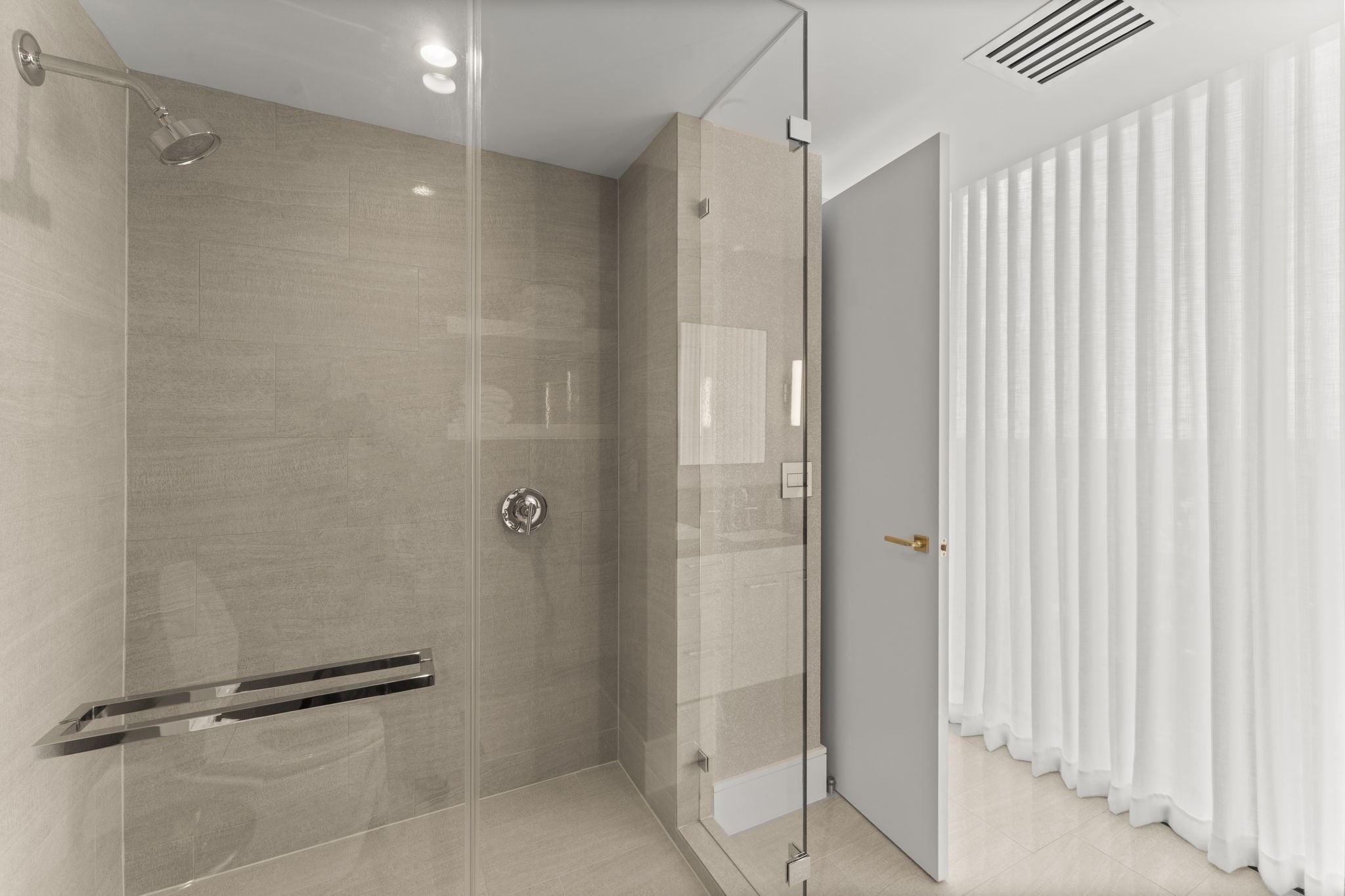 3433 Westheimer Road, Unit 1005 Houston, TX 77027 - Photo 36 of 47 Modern shower enclosure with rain head in secondary bath.