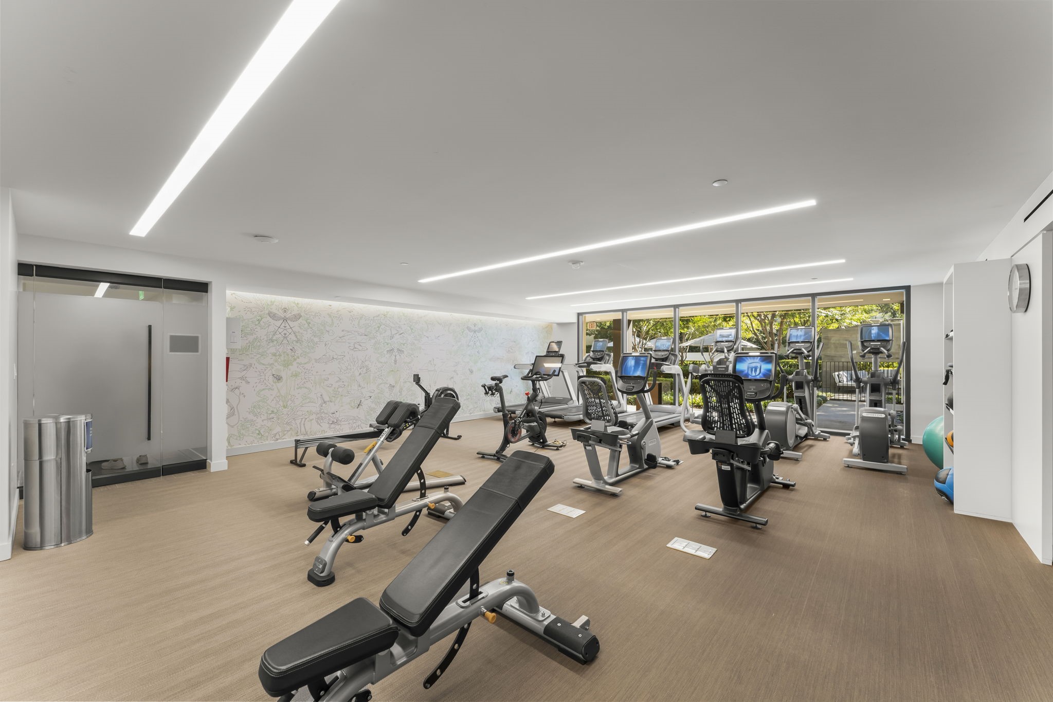 3433 Westheimer Road, Unit 1005 Houston, TX 77027 - Photo 38 of 47 Light-filled fitness studio with cardio, strength, and functional zones—no commute required for a serious workout.