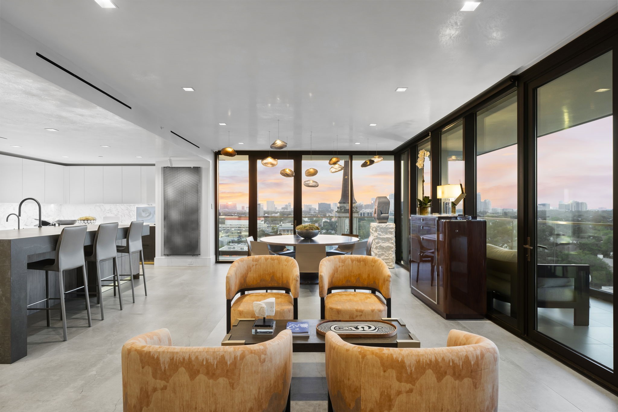 3433 Westheimer Road, Unit 1005 Houston, TX 77027 - Photo 9 of 47 Kitchen-to-dining-to-lounge alignment built for entertaining.