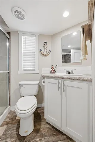 a bathroom with a shower and a toilet