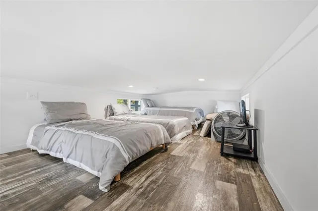 a view of a patio with a dining table and chairs with wooden fence