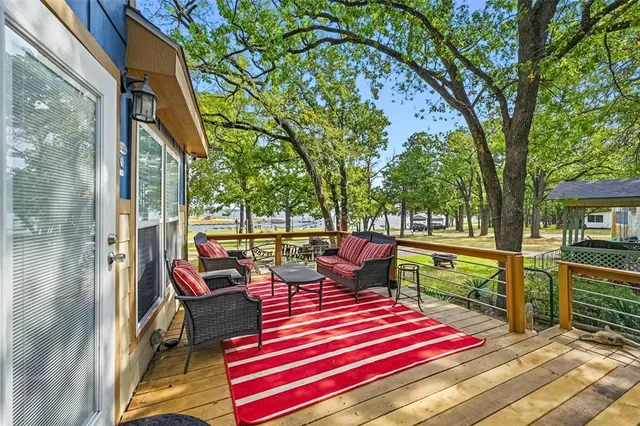 a view of a house with backyard porch and sitting area