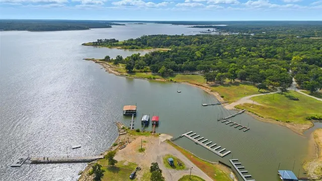 an aerial view of residential houses with outdoor space and swimming pool