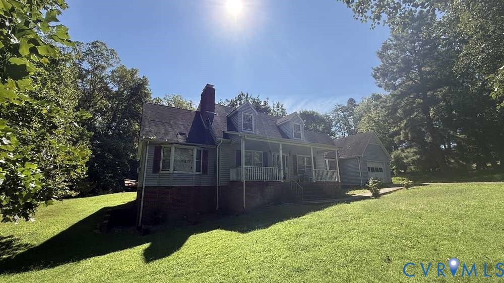 320 Wilson Road Danville, VA 24541 - Photo 14 of 17 Property exterior with dormer windows, a covered f