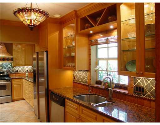 645 North Victoria Park Road Fort Lauderdale, FL 33304 - Photo 13 of 25 a kitchen with a sink and a stove top oven