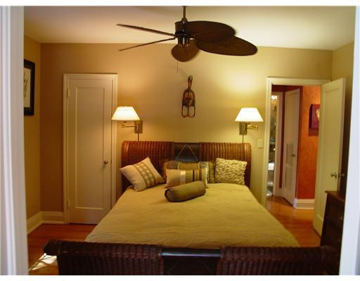 645 North Victoria Park Road Fort Lauderdale, FL 33304 - Photo 22 of 25 a bedroom with a bed and a chandelier