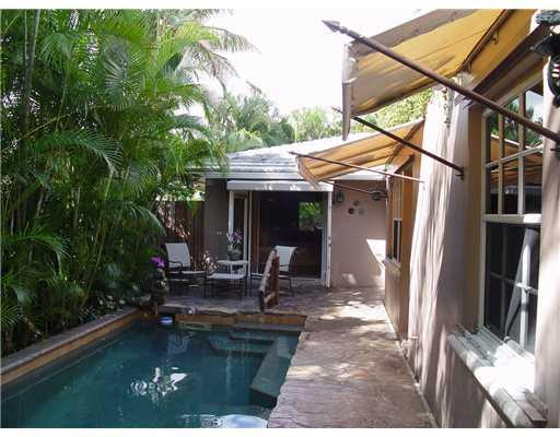 645 North Victoria Park Road Fort Lauderdale, FL 33304 - Photo 5 of 25 a view of house with backyard outdoor seating and hardwood