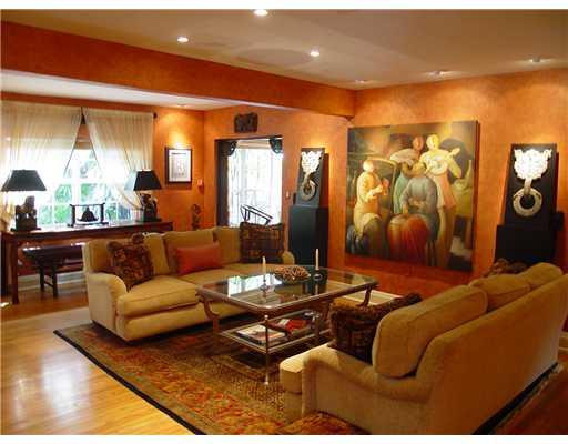 645 North Victoria Park Road Fort Lauderdale, FL 33304 - Photo 7 of 25 a living room with furniture a rug and a floor to ceiling window