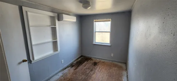 a view of hallway with closet and bathroom