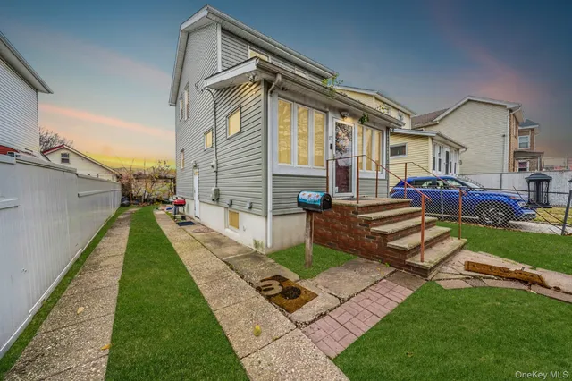 a view of house with a backyard porch and sitting area