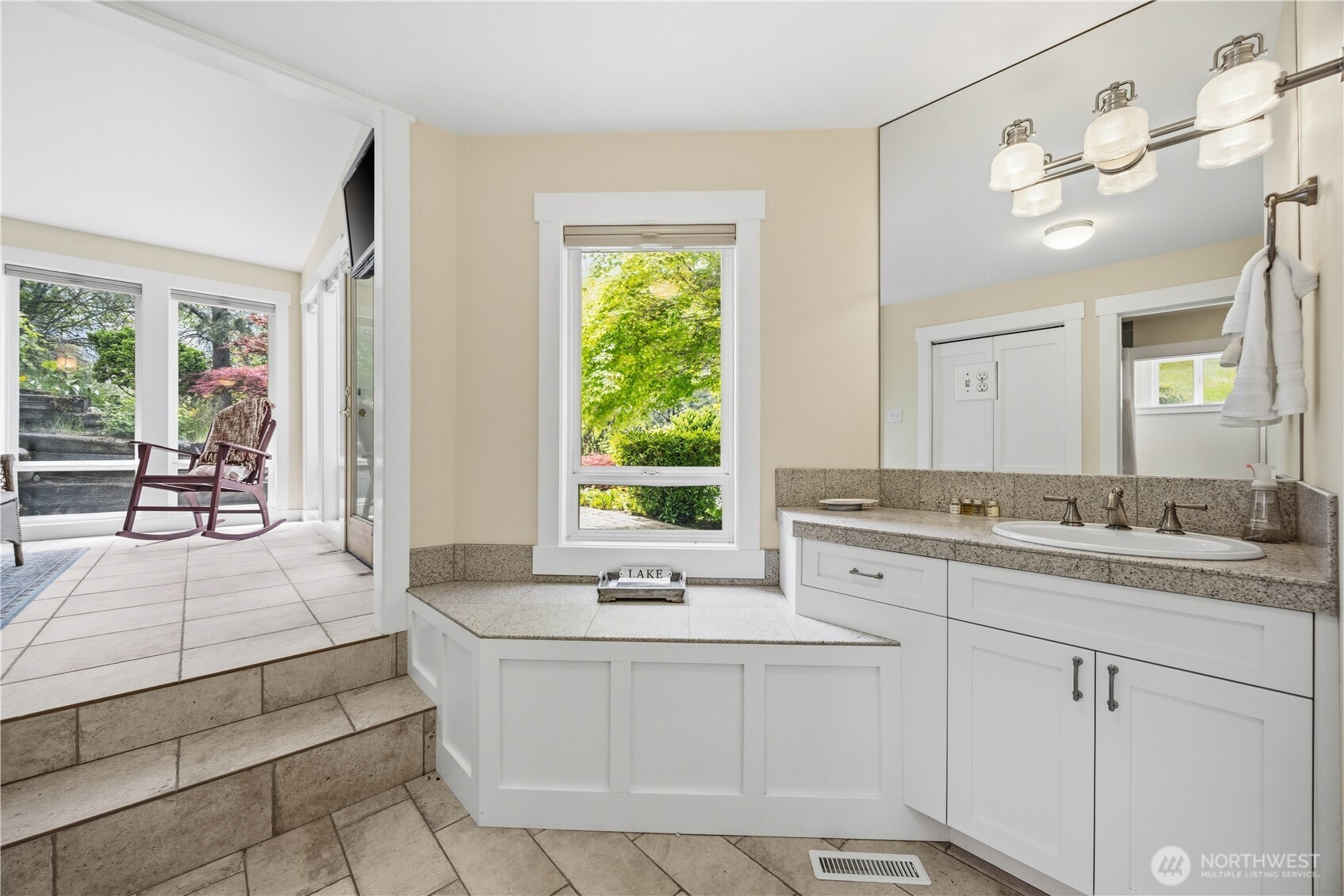 141 Sunset Place Manson, WA 98831 - Photo 28 of 38 a spacious bathroom with sinks mirror and a bathtub