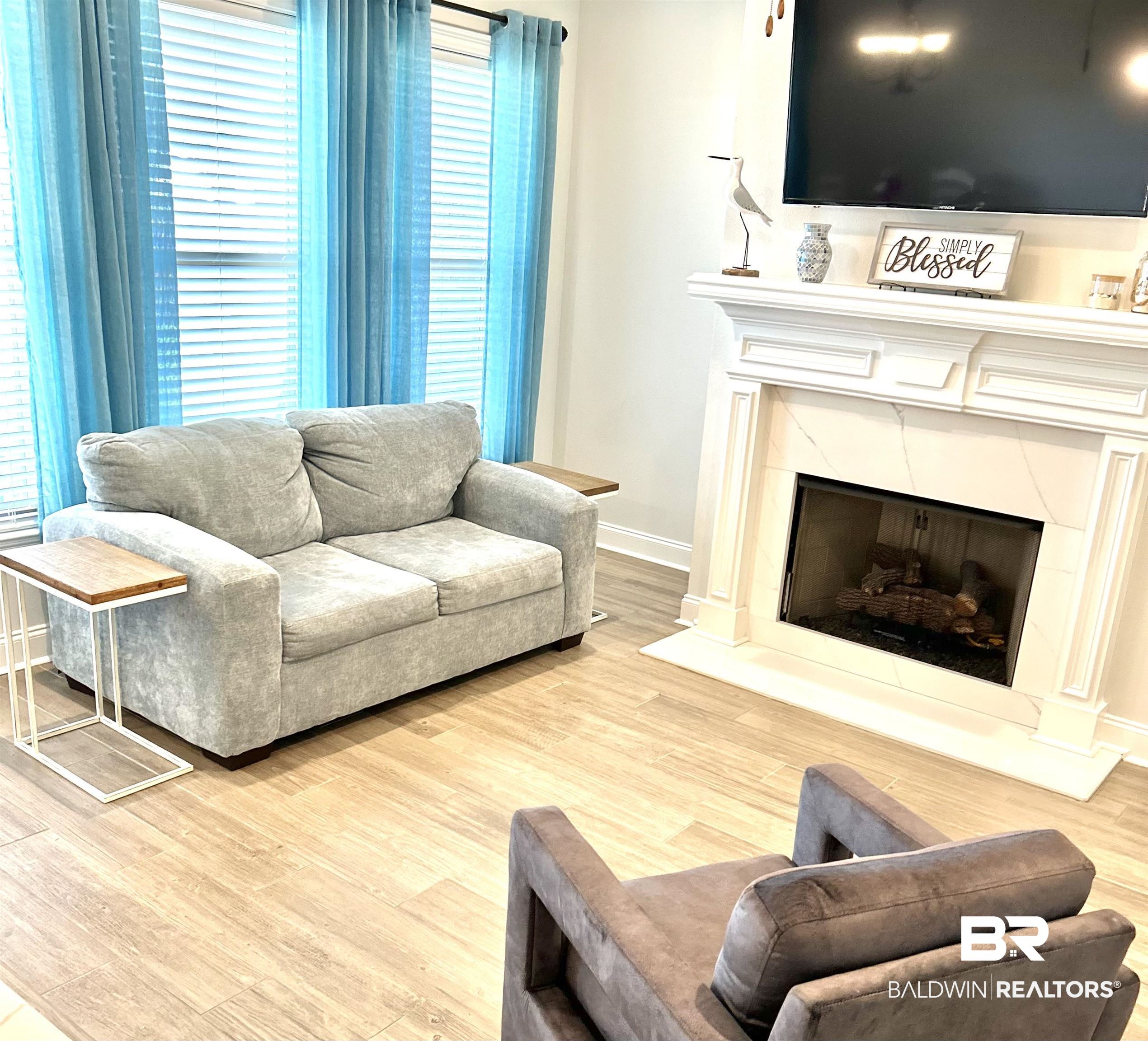 1398 Aldon Street Foley, AL 36535 - Photo 11 of 32 Living room featuring light tile wood-look flooring and a high end gas fireplace