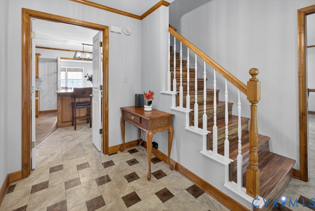 173 Covenant Way Bumpass, VA 23024 - Photo 7 of 63 Entryway featuring patterned flooring, wood trim,