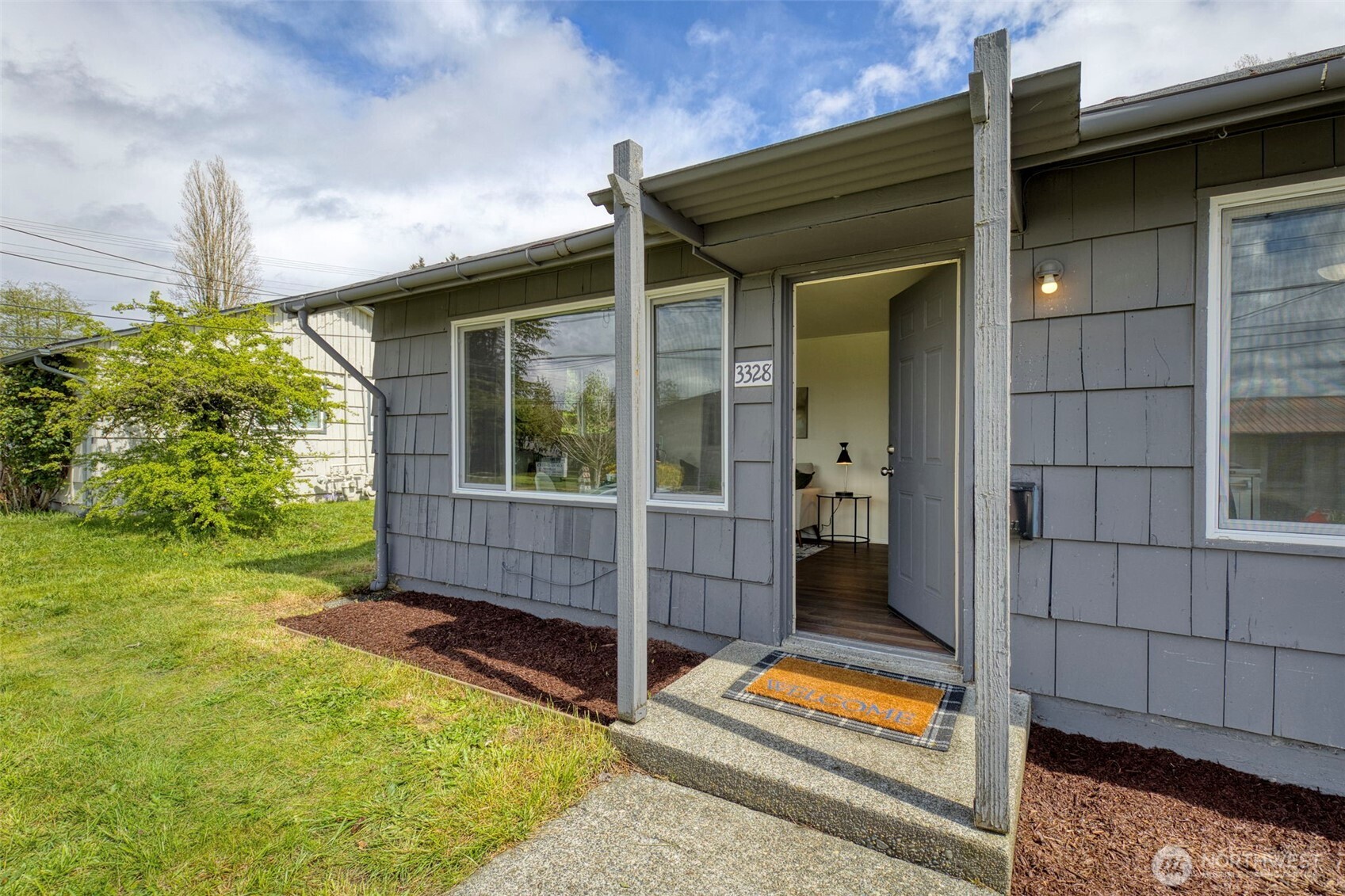 3326-3328 Halverson Avenue Bremerton, WA 98310 - Photo 15 of 36 a view of house with backyard and outdoor seating