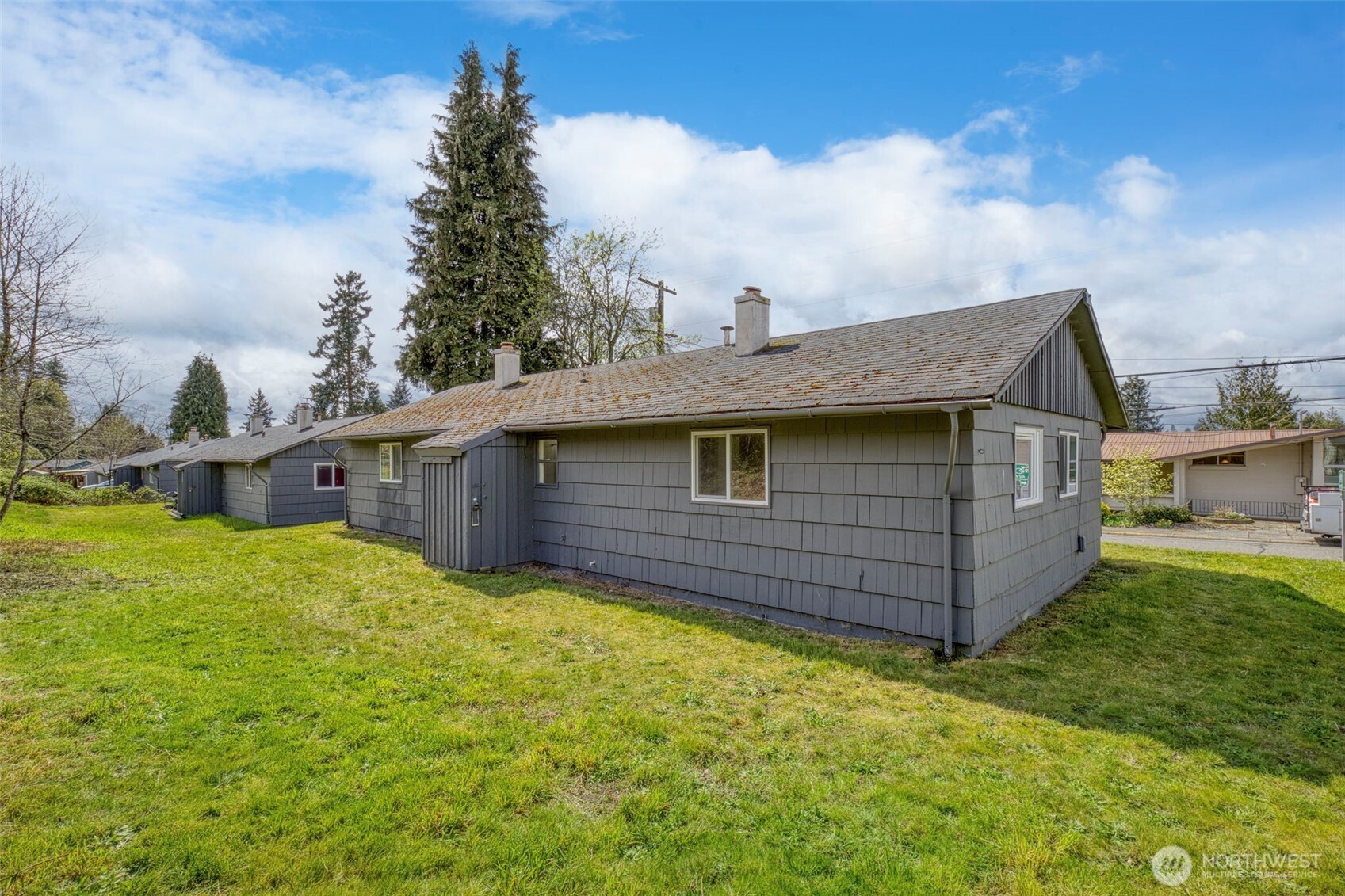 3326-3328 Halverson Avenue Bremerton, WA 98310 - Photo 28 of 36 a view of a house with a yard