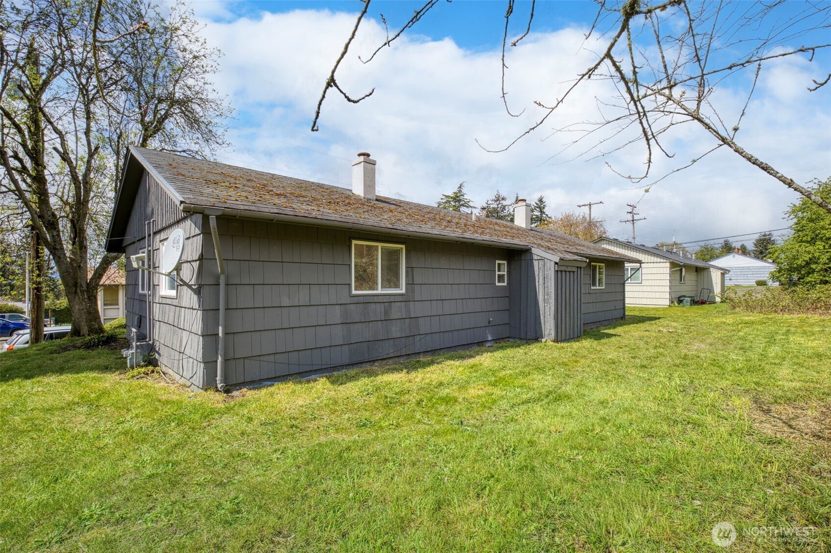 3326-3328 Halverson Avenue Bremerton, WA 98310 - Photo 29 of 36 a view of a house with a yard