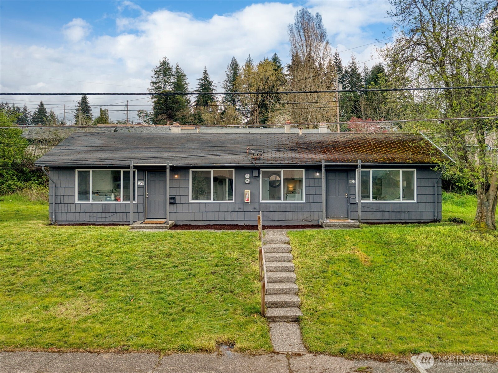 3326-3328 Halverson Avenue Bremerton, WA 98310 - Photo 35 of 36 a front view of a house with a garden