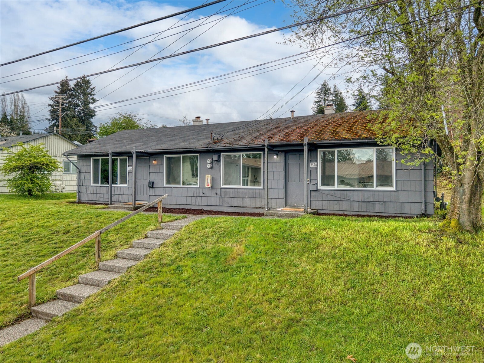3326-3328 Halverson Avenue Bremerton, WA 98310 - Photo 36 of 36 a front view of a house with a yard