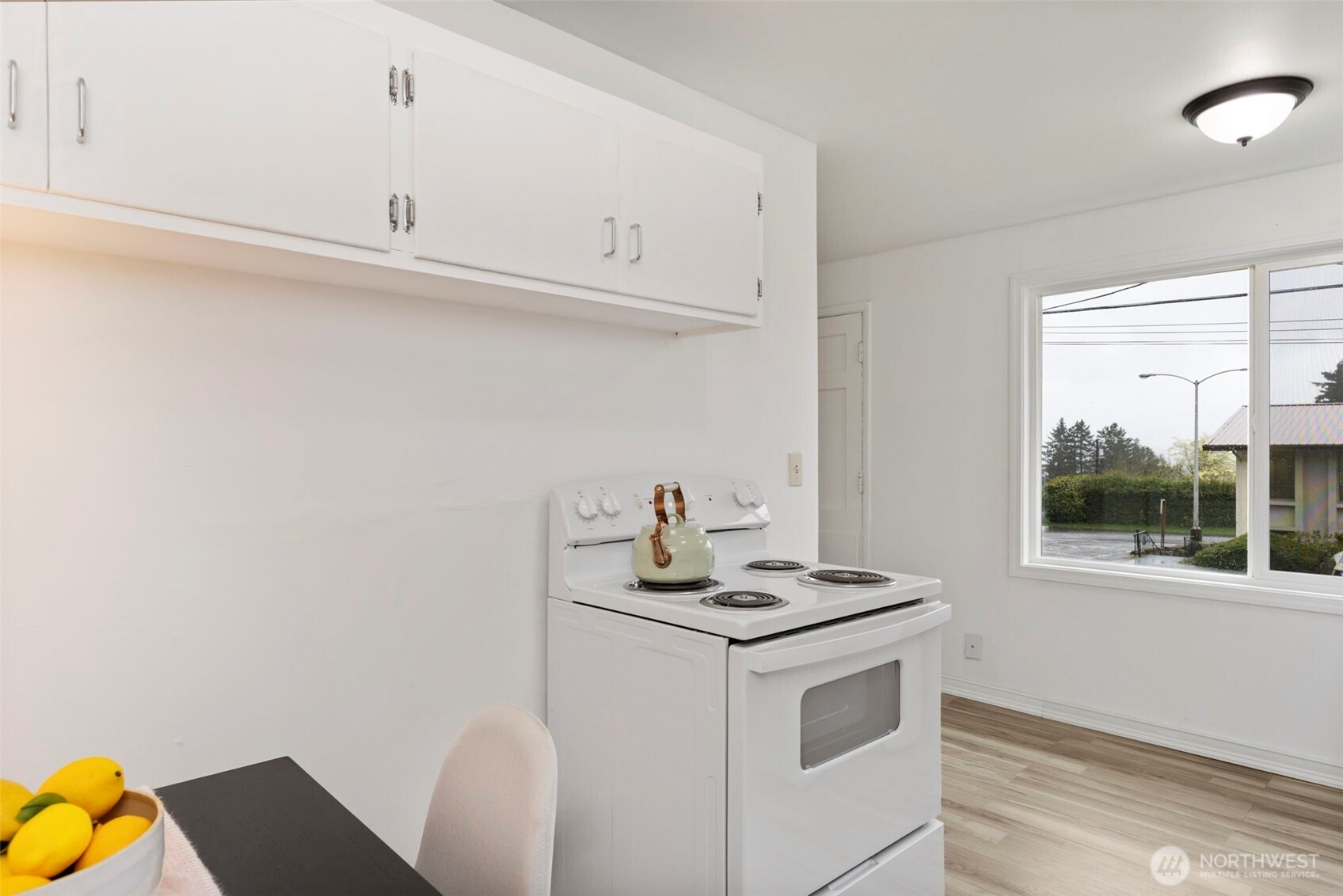 3326-3328 Halverson Avenue Bremerton, WA 98310 - Photo 7 of 36 a kitchen with a sink cabinets and a window