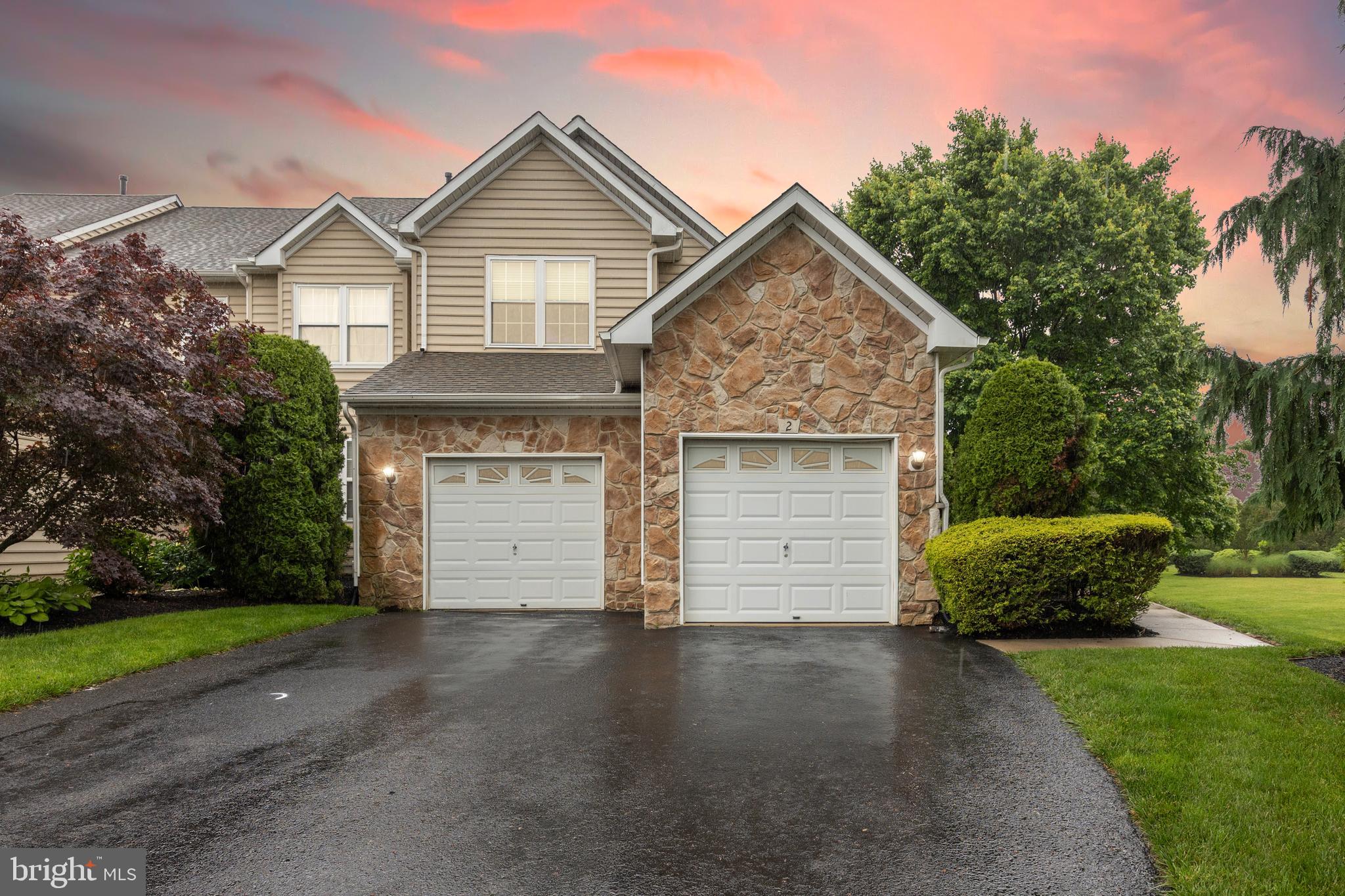 2 Hogan Way Moorestown, NJ 08057 - Photo 18 of 21 a front view of a house with a yard and garage