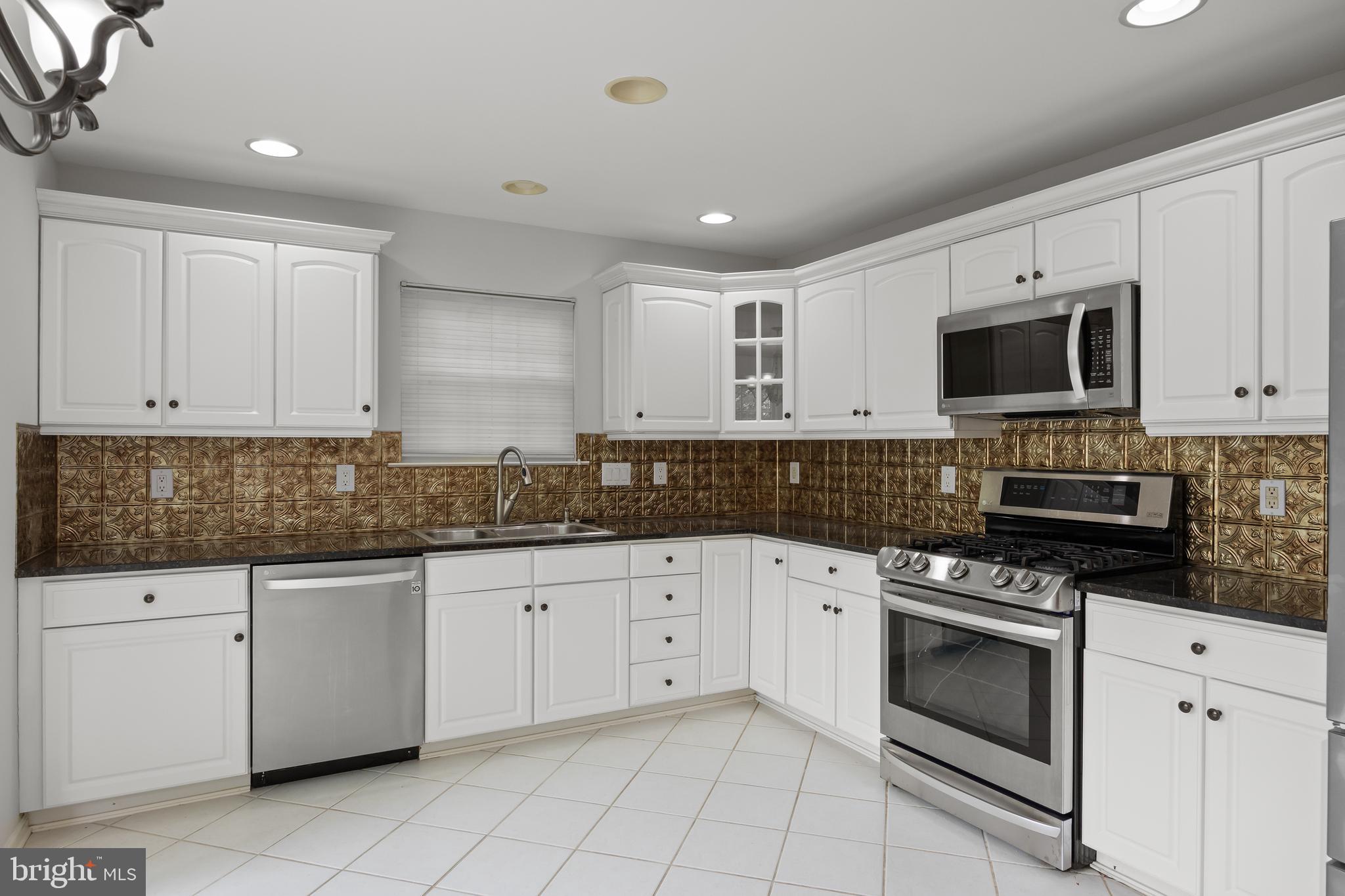 2 Hogan Way Moorestown, NJ 08057 - Photo 6 of 21 a kitchen with granite countertop white cabinets white stainless steel appliances and a sink